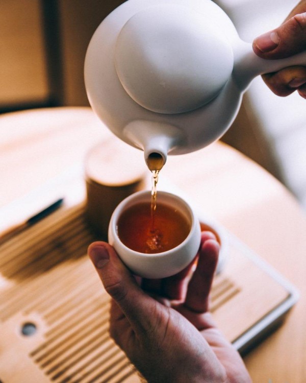 hand-pouring-hot-tea.jpg